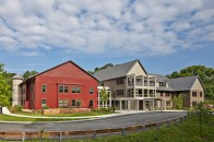 Peter Shaffer, a principal of DiMella Shaffer Architects, drove around the town of Carlisle to draw inspiration for the design of Benfield Farms. The classic-style design reflects the rural area's many large barns, silos, big houses, and connected buildings. "[The architects] had a fabulous plan from the beginning, and I think that's what the town fell in love with," says Toby Kramer, NOAH's director of real estate development.
