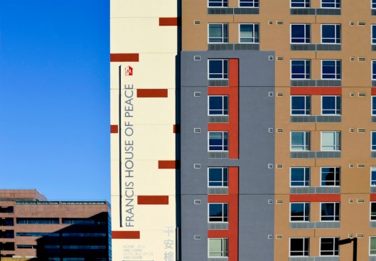 Francis House of Peace, developed by Project HOME and the Philadelphia Chinatown Development Corp., is providing permanent supportive housing for the formerly homeless, young adults, and other low-income households. Project HOME's vision, "None of us are home until all of us are home," appears on the exterior of the building.