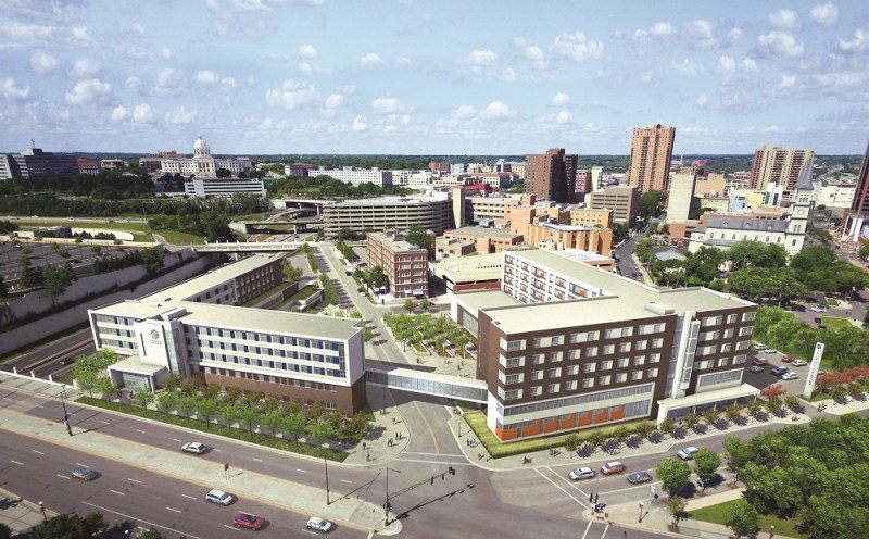 A skyway connects the new Dorothy Day Place building (right) with the first-phase building.