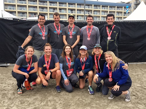 The 2018 Running for Shelter team gather at the finish line.