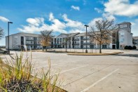 An extended-stay hotel has been adapted into permanent affordable housing for individuals who were homeless and others in Fort Worth, Texas.