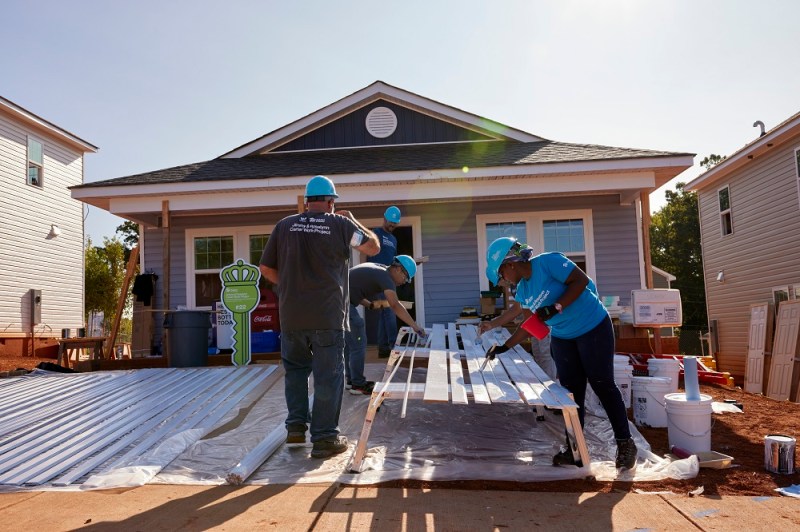 Volunteers come together to help families build their homes at Habitat for Humanity's Jimmy and Rosalynn Carter Work Project in Charlotte, North Carolina.