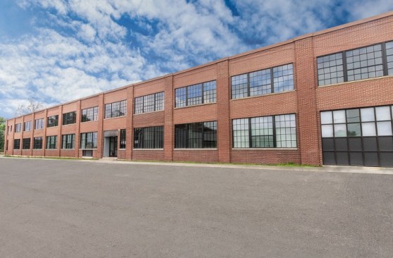 Fourteen91 Lofts involves the restoration of the Muncie Trade School building as well as the construction of new townhomes to create 72 affordable units in Muncie, Ind.