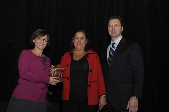 Inductee Amy Anthony (center), president and founder of Preservation of Affordable Housing, with Christine Serlin, executive editor of Affordable Housing Finance, and David Leopold, senior vice president of Bank of America Merrill Lynch.