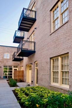 A vacant industrial building that had once been home to a door and window company has been repurposed as affordable housing using low-income housing and historic tax credits.