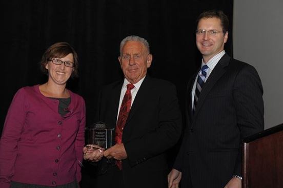 Inductee Wilfred Cooper Sr. (center), founder and chairman of WNC & Associates, Inc., with Christine Serlin, executive editor of Affordable Housing Finance, and David Leopold, senior vice president of Bank of America Merrill Lynch.