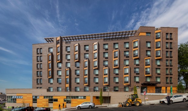 The building, which houses The Apartments at Landing Road and Reaching New Heights Residence includes nine bright, energy-efficient floors, including common terraces and rooftop solar panels.