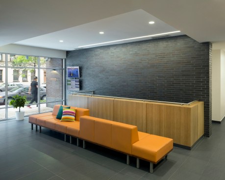 The LEED Platinum building is loaded with green features, including photovoltaic panels that help power the building’s common areas. A TransitScreen in the lobby displays updates on the building’s energy consumption as well as real-time transit information. 
