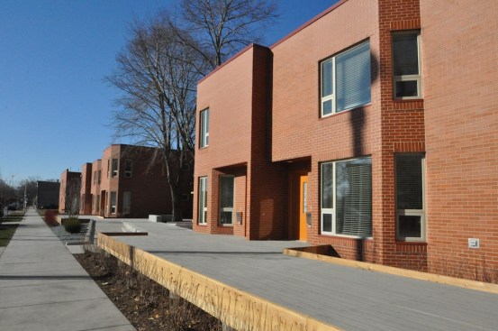 The Rebuild Foundation and Brinshore Development partnered to transform an abandoned public housing development into 32 mixed-income rentals and a new arts center. During the rehabilitation, the development team took four of the two-story townhomes and turned them on their sides to create flats, which included two ground-floor, handicapped-accessible units.&nbsp;