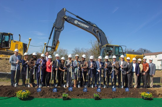 Officials mark the start of construction of the Lockbourne Greene affordable housing community. Participants (from left) are Mike Goerdt, vice president, Cedar Rapids Bank & Trust; Gretchen West, executive director, Healthy Homes; Ohio House Rep. Latyna Humphrey; Ohio Sen. Hearcel Craig; Jeffrey J. Woda, Woda Cooper Cos, (in back); Kelly D’Ambrosia, president, Bank of America Columbus; Miles Cary, Bank of America; Franklin County Commissioner Erica Crawley; U.S. Rep.  Joyce Beatty; Franklin County Treasurer Cheryl Brooks Sullivan; Lark Mallory, president and CEO, Affordable Housing Trust for Columbus & Franklin County; The Rev. John Edgar, executive director, Community Development for All People; U.S. Rep. Mike Carey; Franklin County Commissioner Kevin Boyce; John Evans, Mutual Federal Bank; Travis Sanders, Riverside Bank of Dublin; Guy Ford, director of legislative affairs, Ohio Housing Finance Agency; Dan Ludwig, CFBank; Jean Ryan, president, Columbus-Franklin County Finance Authority; Colin Page McGinnis, CEO, SproutFive/South Side Early Learning; and Michael Stevens, director of development, city of Columbus.