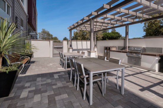 The development achieved LEED Homes Platinum certification. Green features include efficient HVAC systems, 100% fluorescent lighting, Energy Star appliances, and an extensive solar photovoltaic system that offsets the building common area energy load. A water-efficient irrigation system meets the city's water conservation goals. Drought-tolerant planting has also been added to the landscaping.