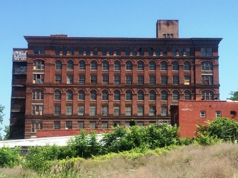 The prominent building, which had been a factory and later a furniture warehouse, sat vacant for several years before being rehabilitated into housing.