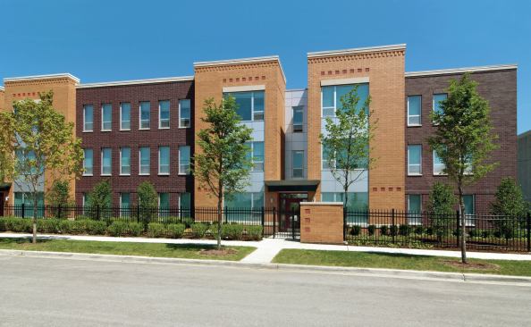 Several of the buildings include architectural ornaments such as limestone window headers and masonry detailing salvaged from demolished historic homes. 